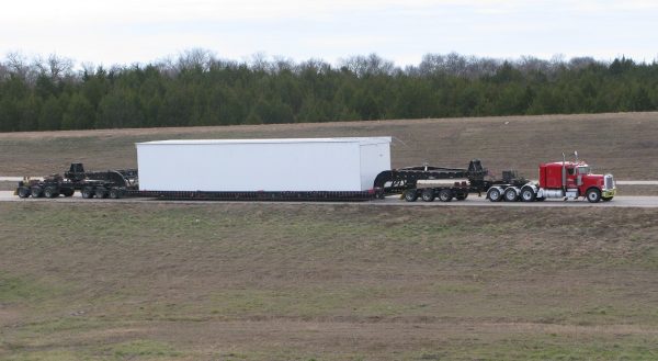 Heavy H Section PF5803-JACOBS BUILDING-SECTION 2 006 2 Lone Star Transportation truck transporting oversized project container