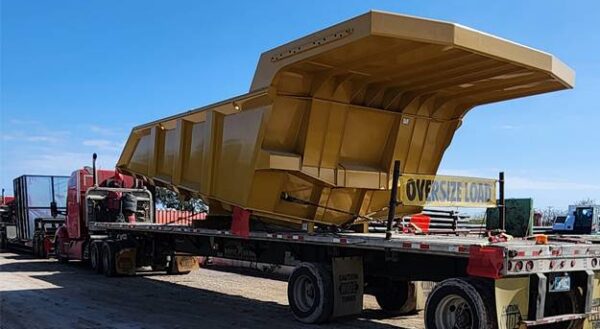 types-construction-equipment Lone Star flatbed hauling oversized construction equipment