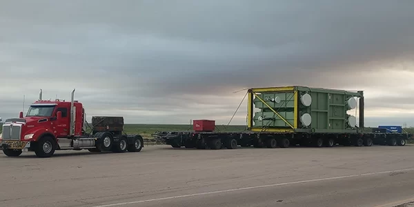 AI_DataCenters_Slider4 Lone Star truck transporting data center equipment on North American highway
