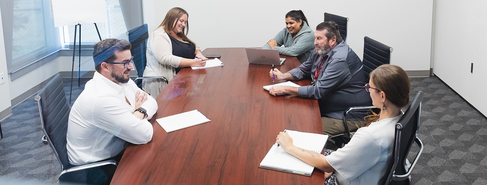 Seaboard Transport Group transportation & logistics employees huddling for staff meeting