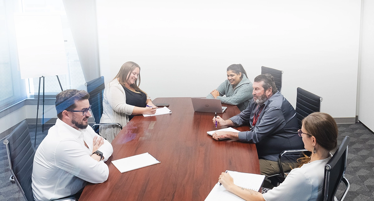 Seaboard Transport Group transportation & logistics employees huddling for staff meeting